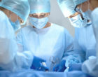 Operating team performing surgery in a modern hospital